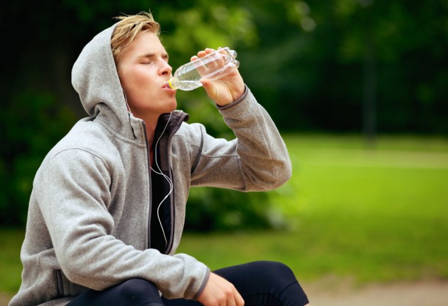 Man at the Park Drinking Water